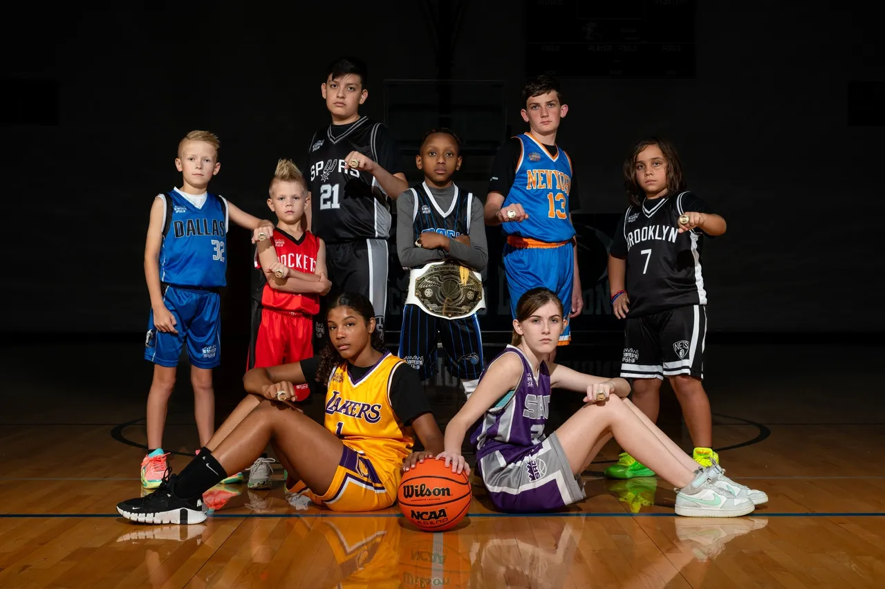 A group of young people in basketball uniforms.