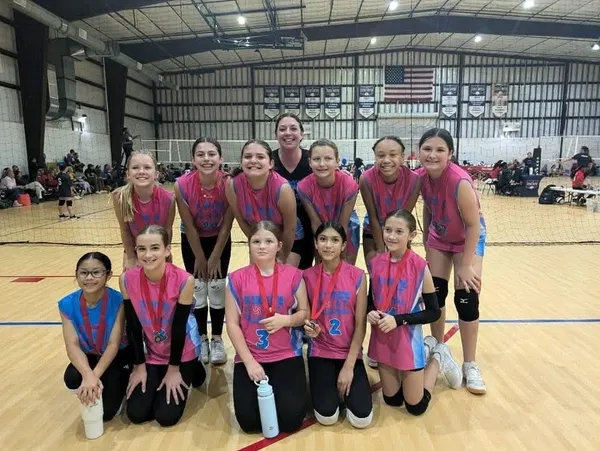A group of girls standing in front of each other.