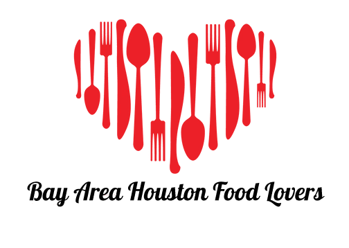 Red utensils forming a heart shape.