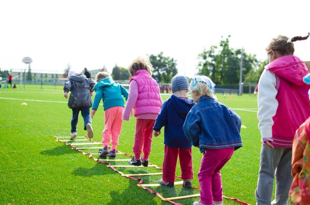 Young athletes performing dynamic warm-up drills before practice