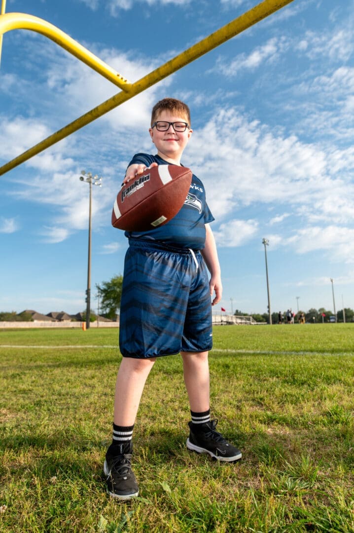 Youth football player breaking away on a run