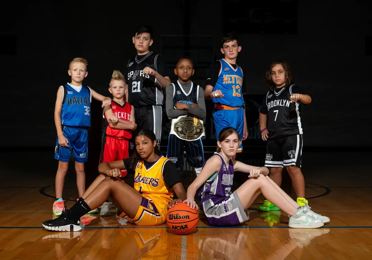 A group of young people in basketball uniforms.