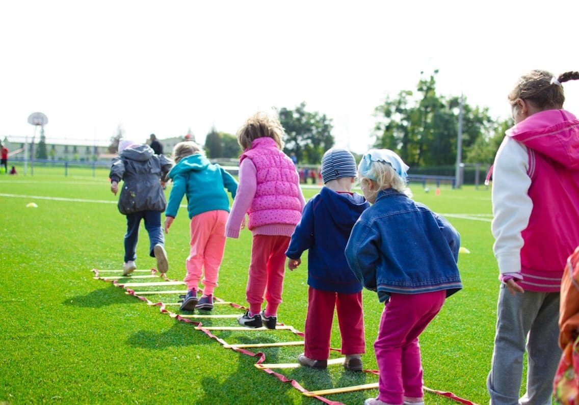 Young athletes performing dynamic warm-up drills before practice
